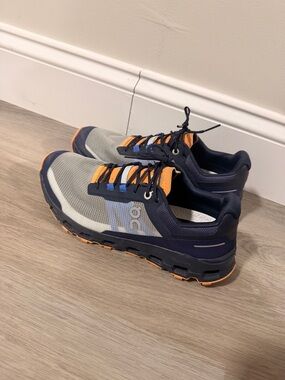 On Running Women’s Gray and Navy Running Shoes with Orange Accents